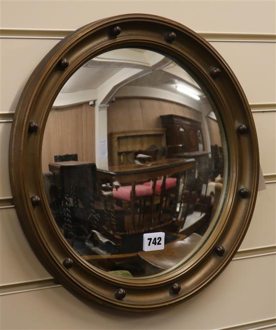 A gilt circular wall mirror W.38cm